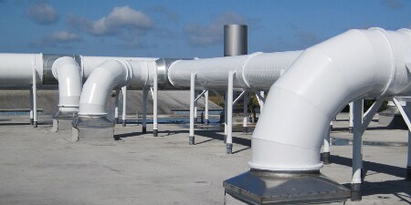 Image of exterior HVAC ducting with an insulation wrap protecting the underlying insulation
