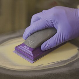 body filler being sanded