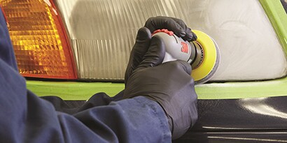 angle sander removing oxidation from large truck headlight lense
