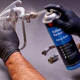 Adhesive removal in use on metal part