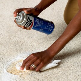 Person cleaning carpet with Scotchgard Spot Remover