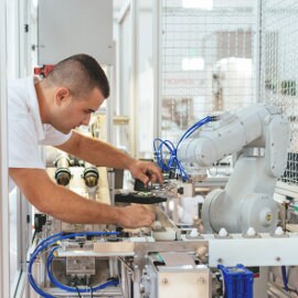 man working on a robot