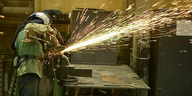 image of grinder with a lot of sparks flying off
