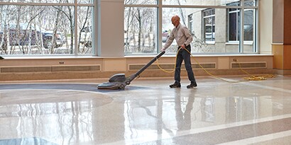 man caring for floor

