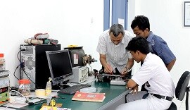 Students receive tutoring in electronics at YCAB