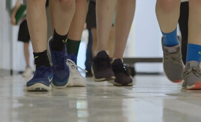 students walking on clean floor
