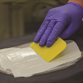 applying glaze to the damaged area