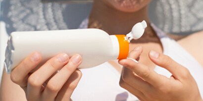 Person putting lotion onto their hand to show the chemical resistance of 3M electronics bonding solutions.
