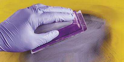 fine grade abrasive preparing a filled area for repair
