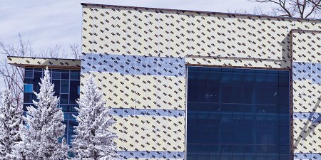 Winter image of a building wrapped in a 3M™ Air Barrier before outer panels are applied
