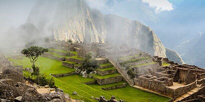 The early morning mist lifting from the Lost City of Machu Picchu.
