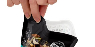 Image of a user closing a resealable pouch

