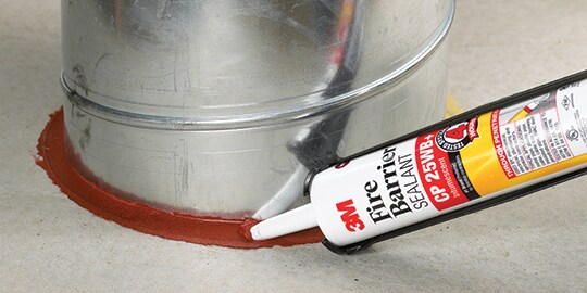 3M™ Fire Barrier Sealant CP 25WB+ being applied to a through-penetration in a floor
