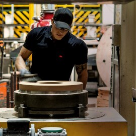 image of person standing next to a workbench