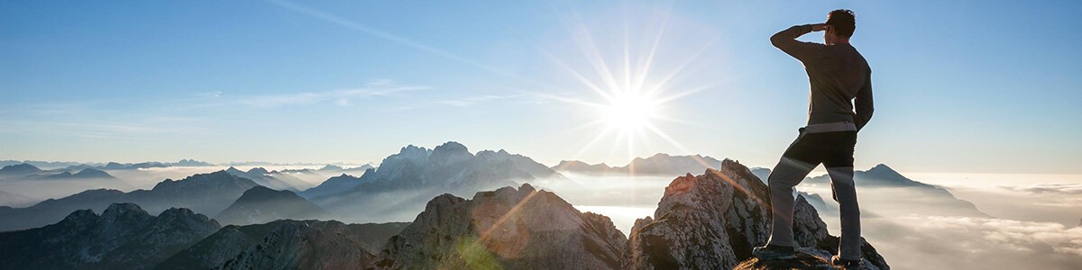 Man standing on top of mountain
