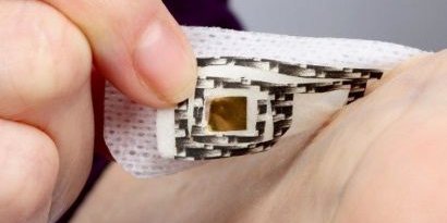 Close-up image showing a person putting a wearable device onto an arm
