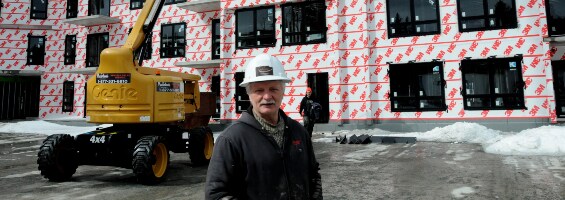 Image of Birkshire Developments founder Mike Young in front of a building where a 3M air barrier membrane has been applied