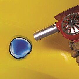 heat gun heating plastic repaired fiberglass area